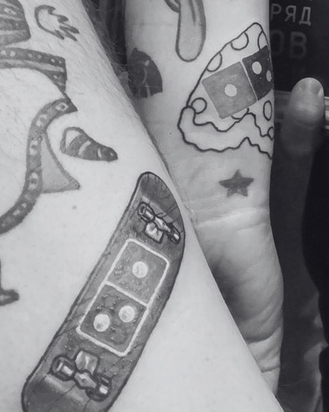 Domino's tattoos on customers' arms featuring the brand's logo.